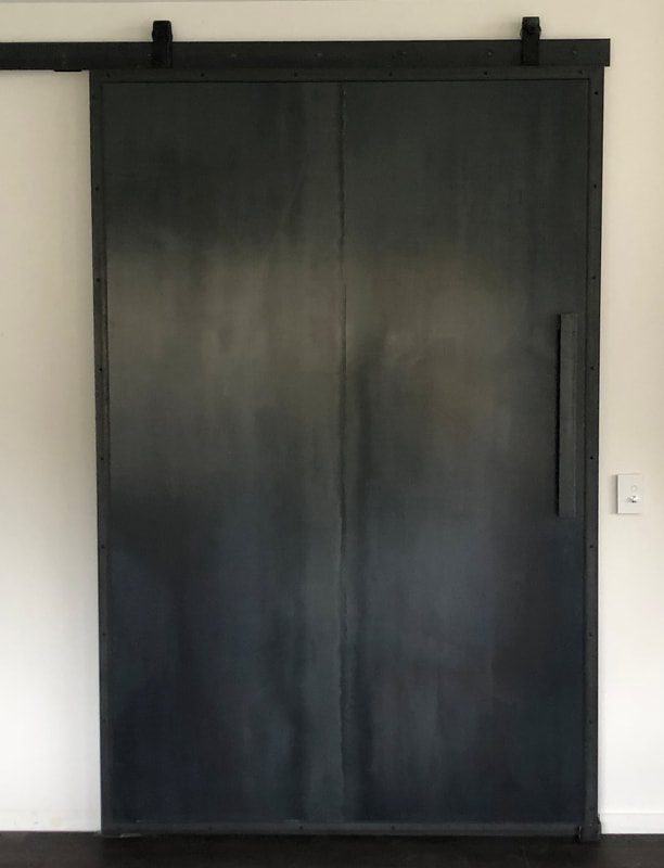 Blackened steel sliding door