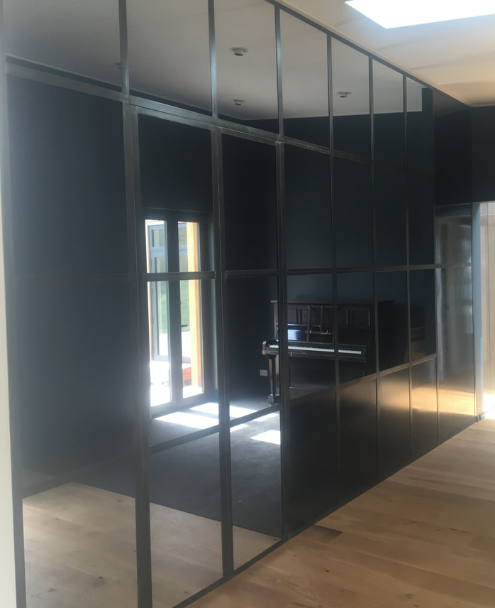 Mirror wall with steel boarders