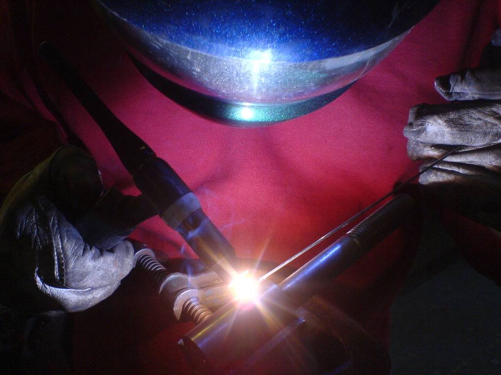 Action photo of person welding